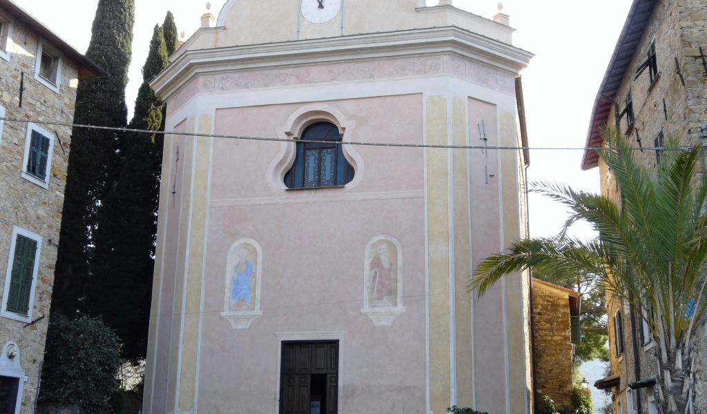 House with a clock in the resort of Bordighera, Italy