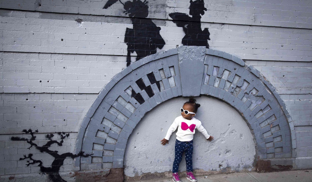 Little girl near graffiti