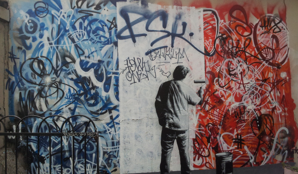 Уличный художник нарисован на стене