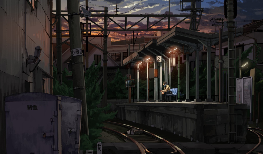 Одинокий парень на железнодорожной станции