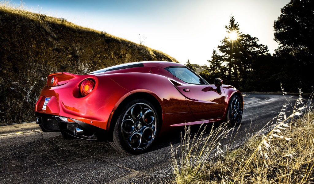 Red Alfa Romeo 4C at the turn of the road