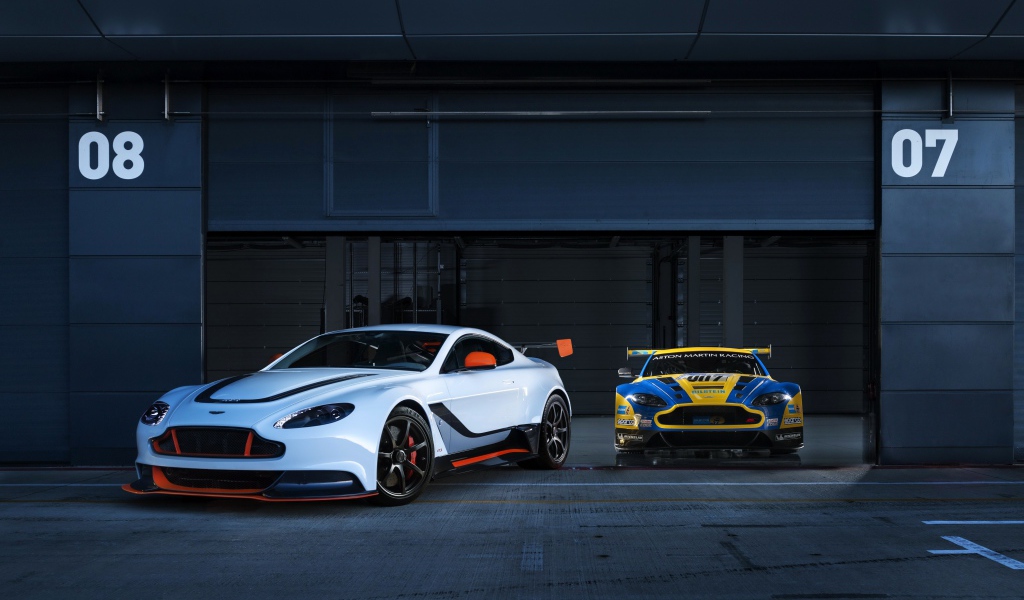Two cars Aston Martin go out of the garage