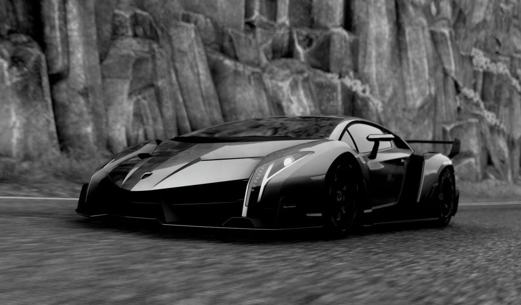 Черный Ламборгини у каменной скалы