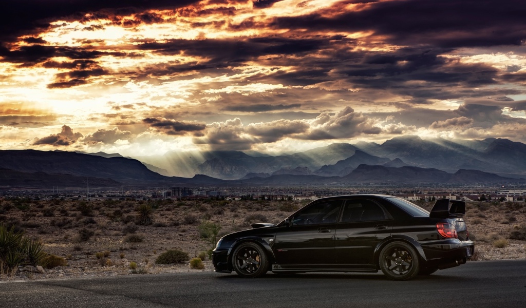 Черный Subaru WRX ST на фоне равнины