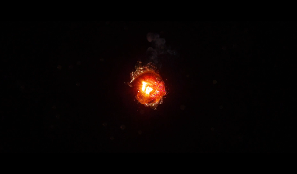 Горящий уголек, черный фон