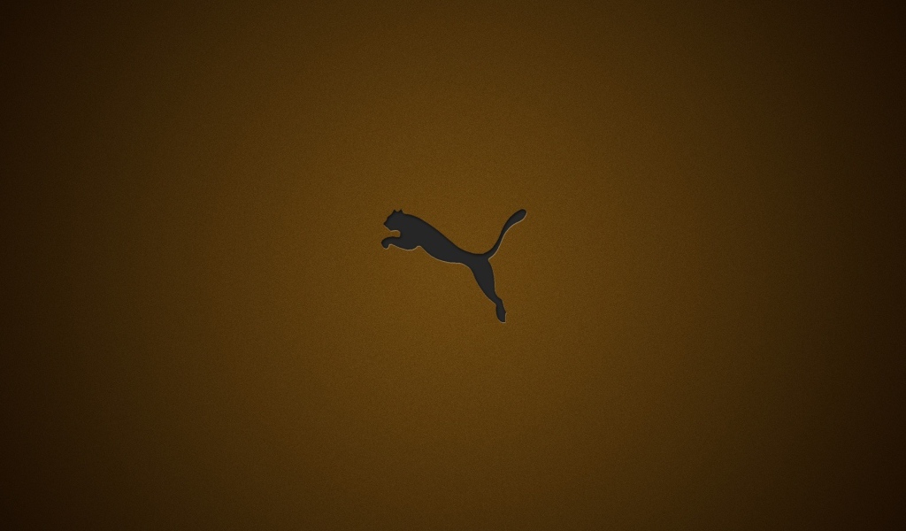 Логотип фирмы Пума на коричневом фоне