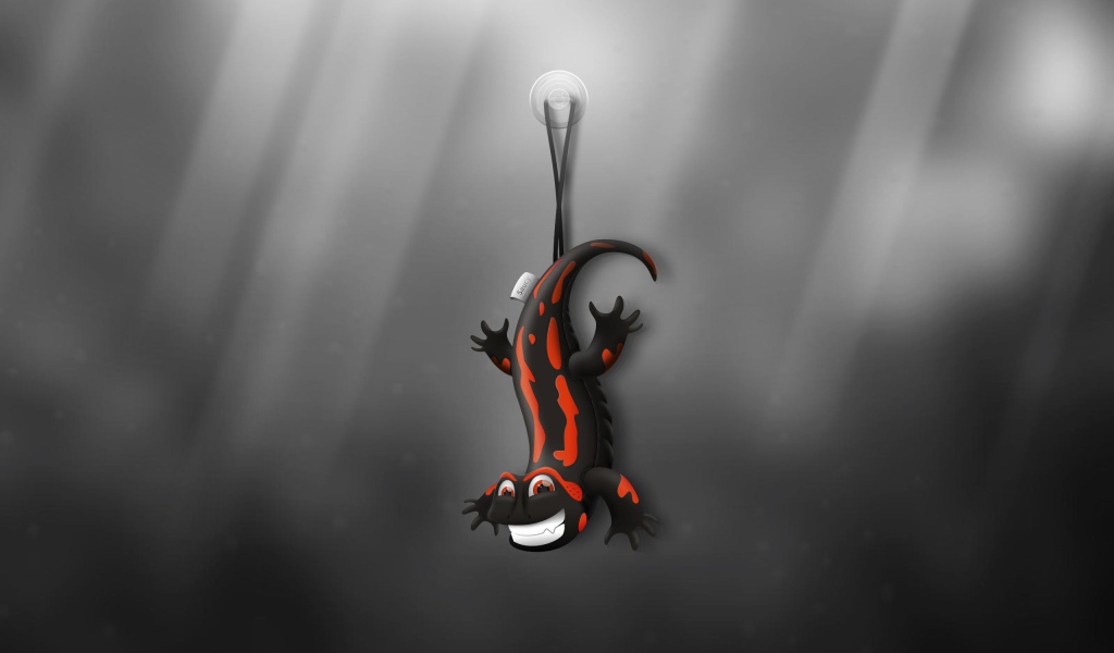 Ящерица игрушка, серый фон