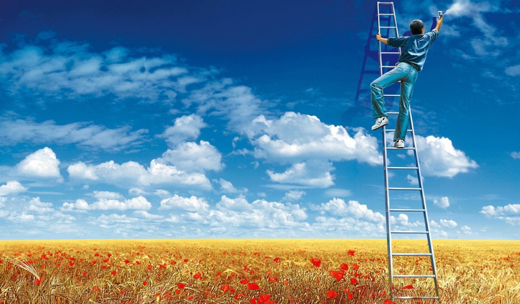 Мужчина рисует облака