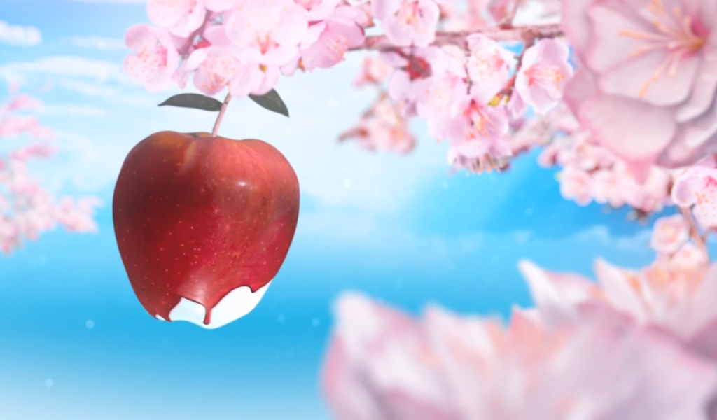 Красное яблоко среди розовых цветов