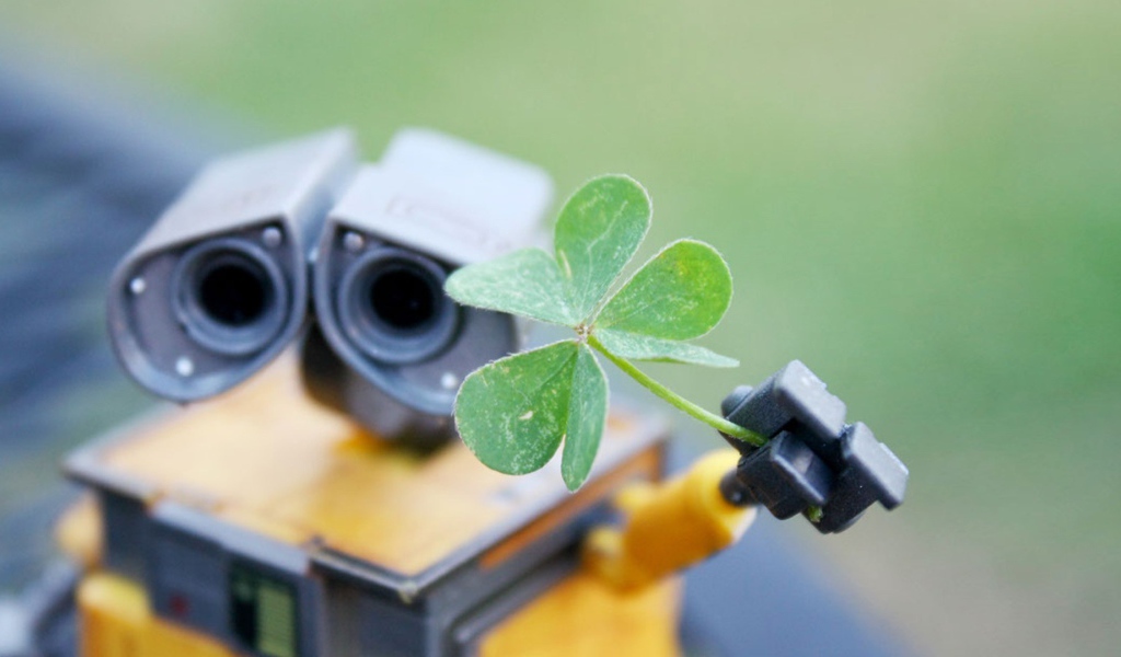 Робот Валли подает зеленый росток