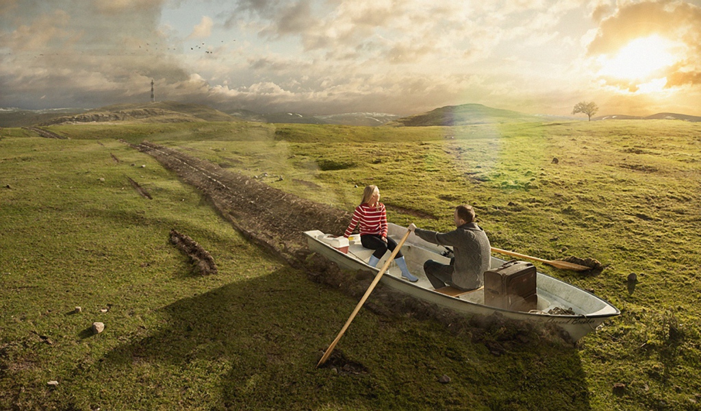 Двое в лодке среди поля