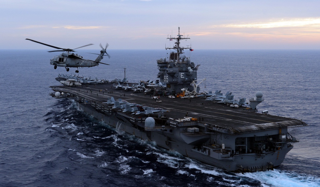 Helicopter on the background of an aircraft carrier