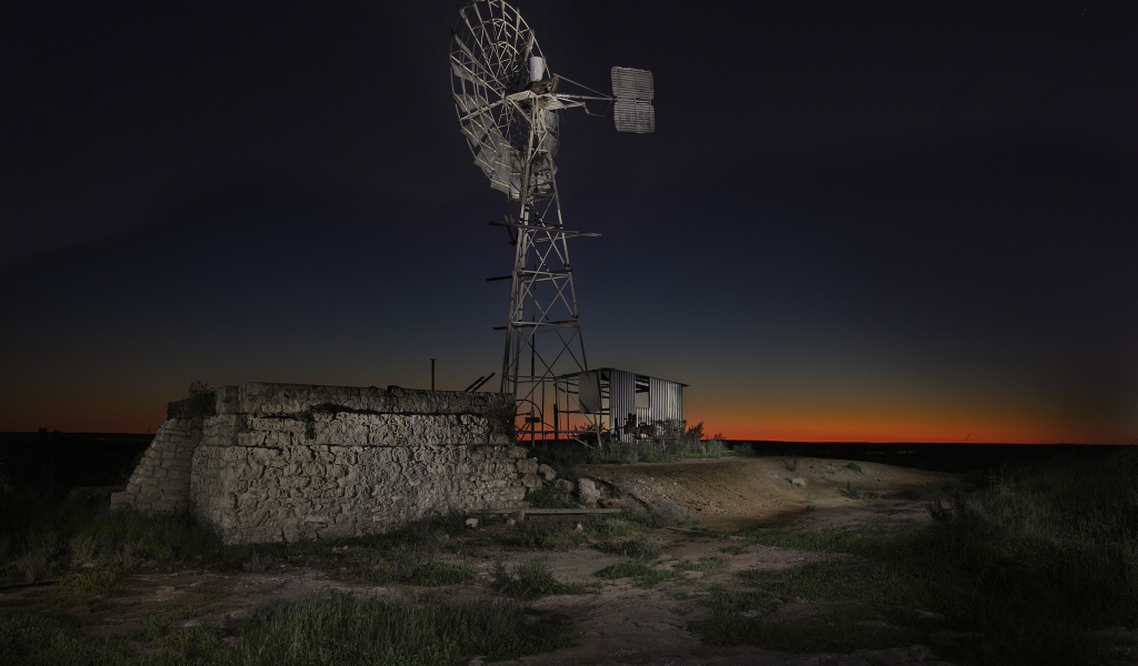 Wind turbine under the night sky in Australia