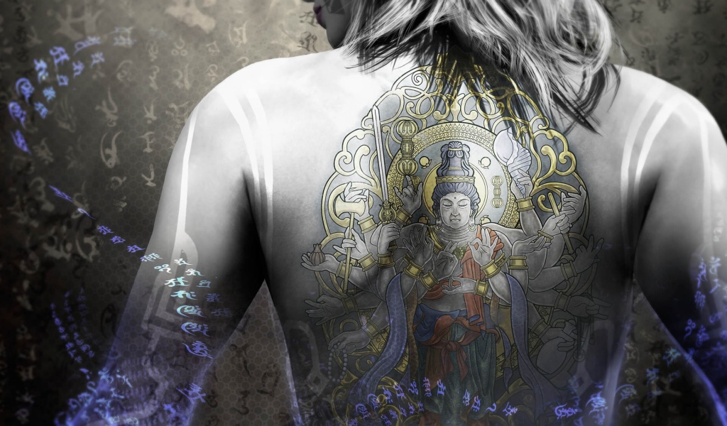 Buddha Tattoo on the back of the girl