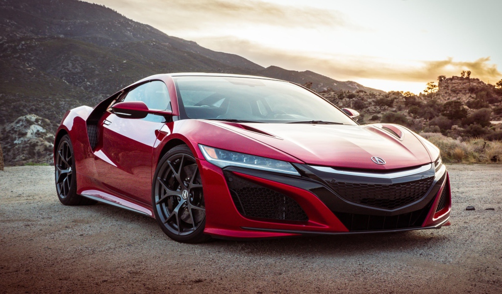 Красный автомобиль Acura NSX, 2017 на фоне гор 