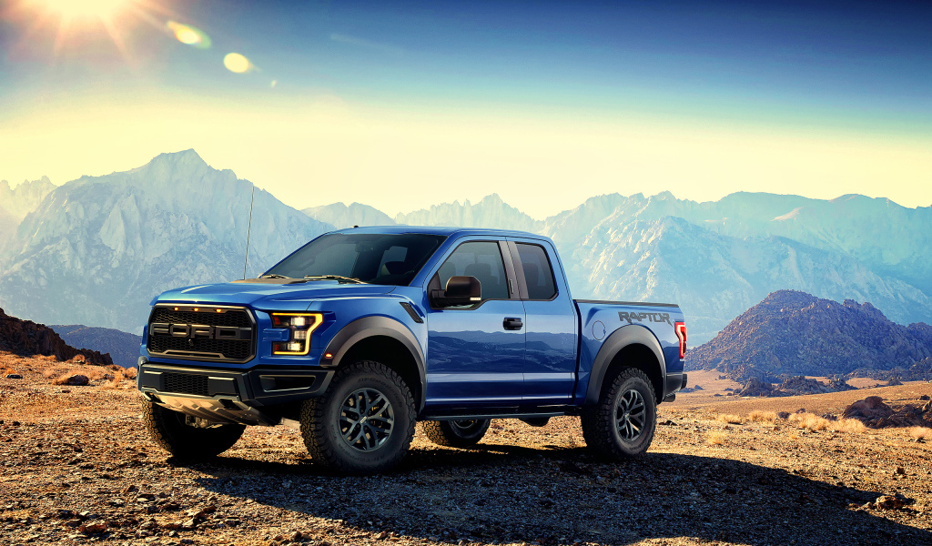 Blue pickup Ford F-150 Raptor, 2017 amid the mountains