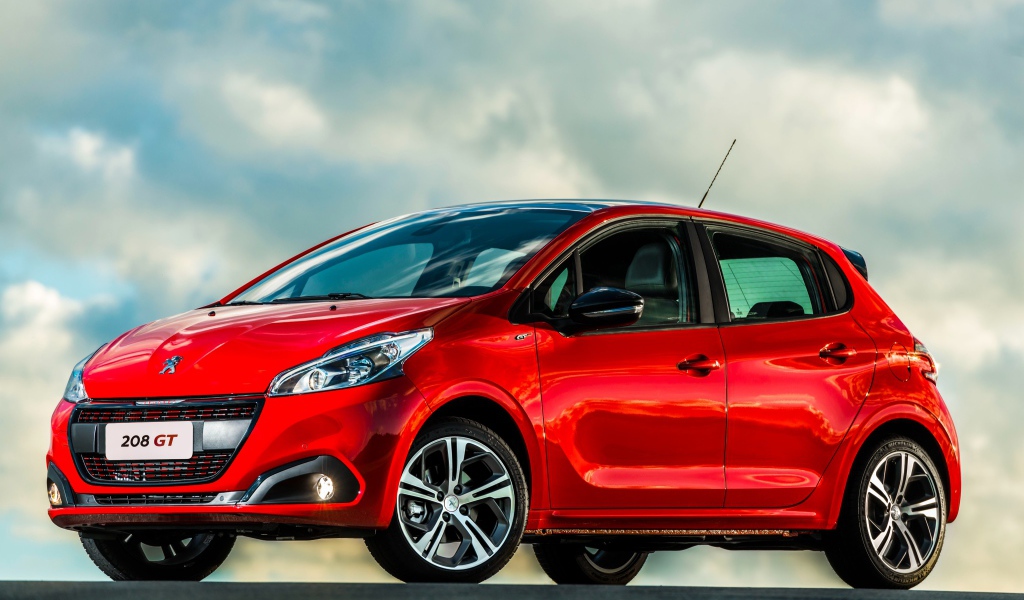 Красный автомобиль хэтчбек  Peugeot 208 GT