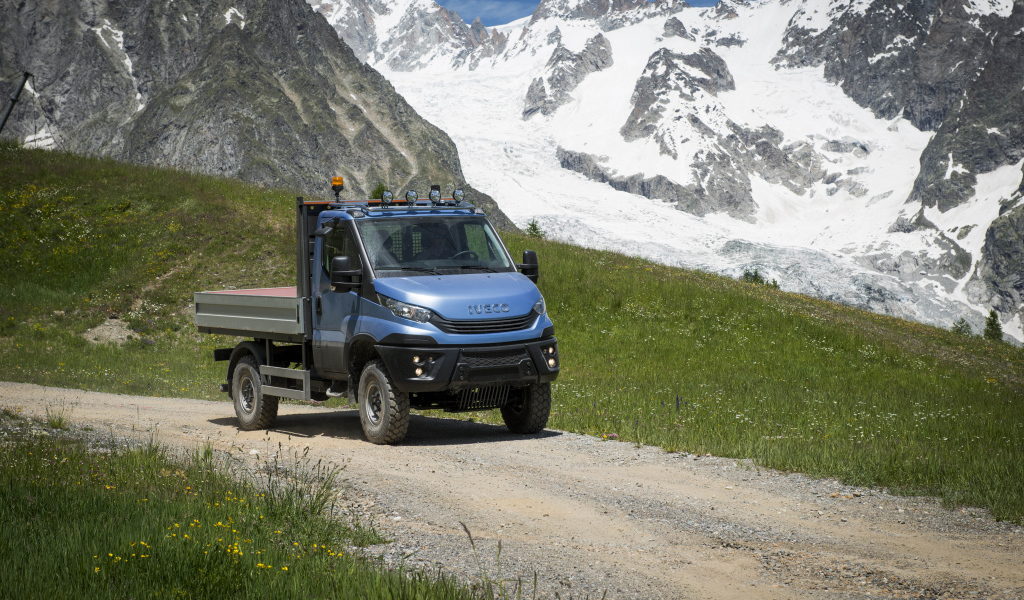 Blue IVECO Daily 55 4x4 Chassis Cab on the background of the mountains
