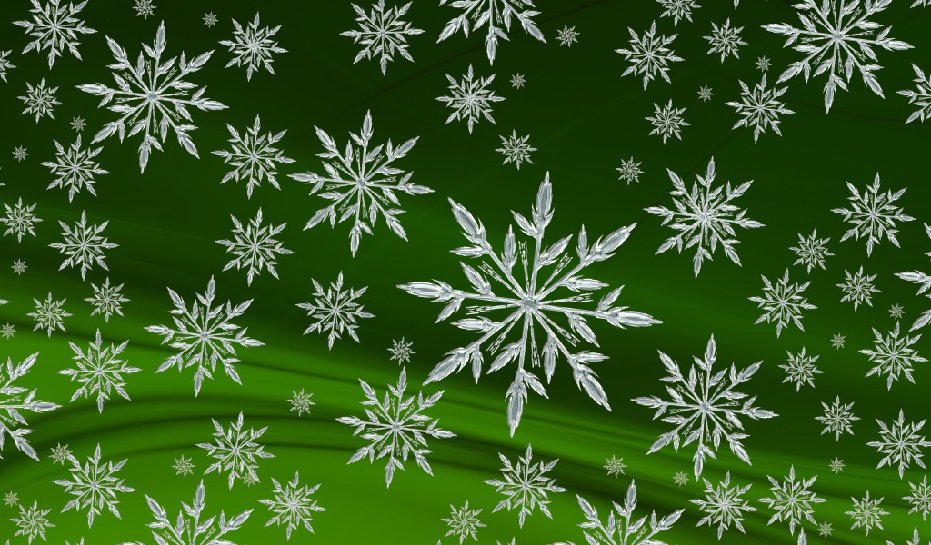 Кристальные белые снежинки на зеленом фоне