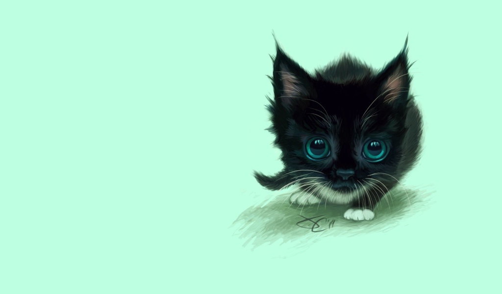 A small painted black kitten with big green eyes