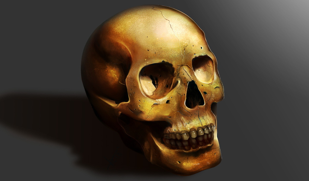 Золотой череп на сером фоне