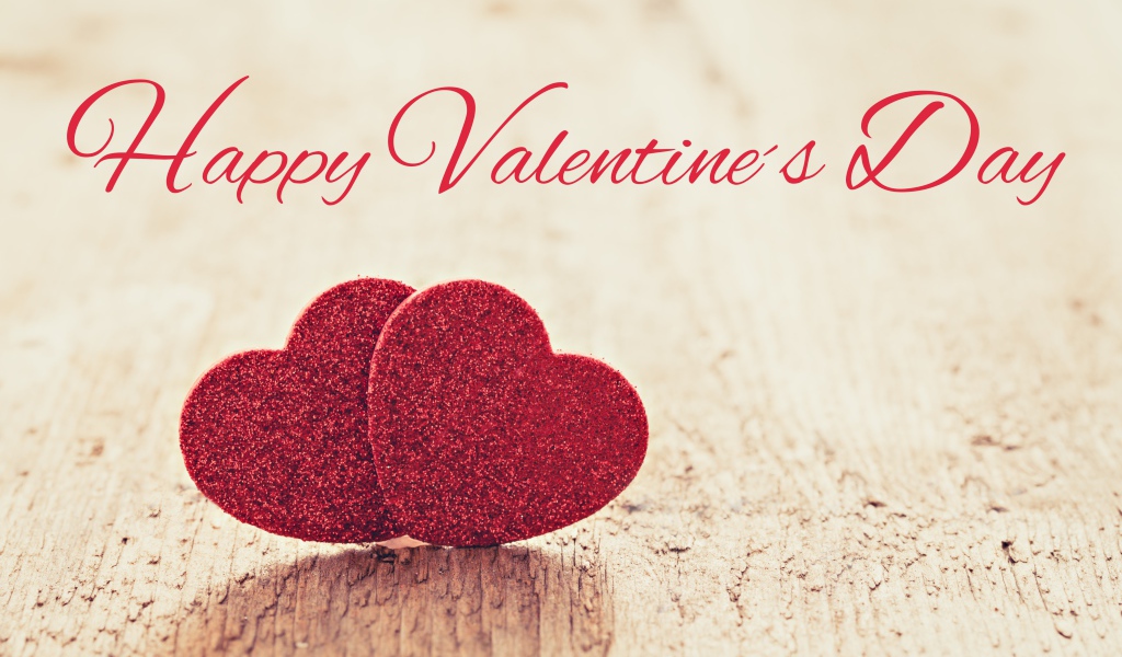 Два красных сердца на фоне надписи С Днем Святого Валентина