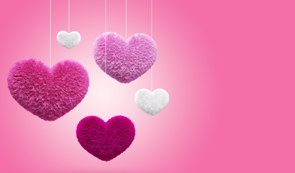 Мягкие пушистые сердечки на розовом фоне 