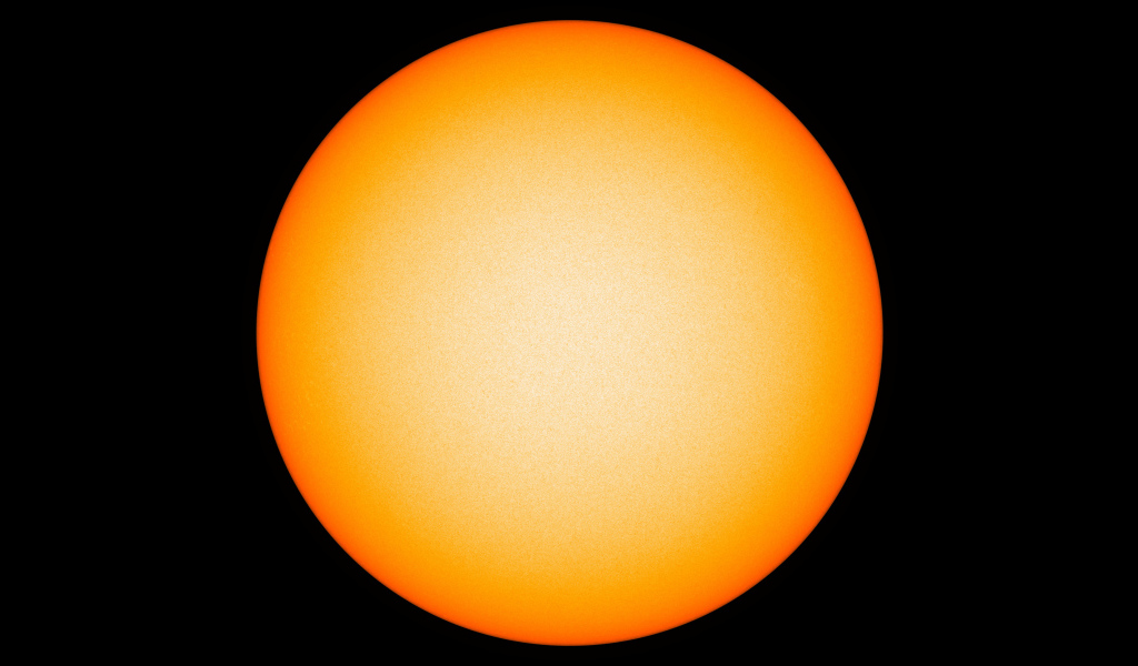 Яркое желтое солнце на черном фоне