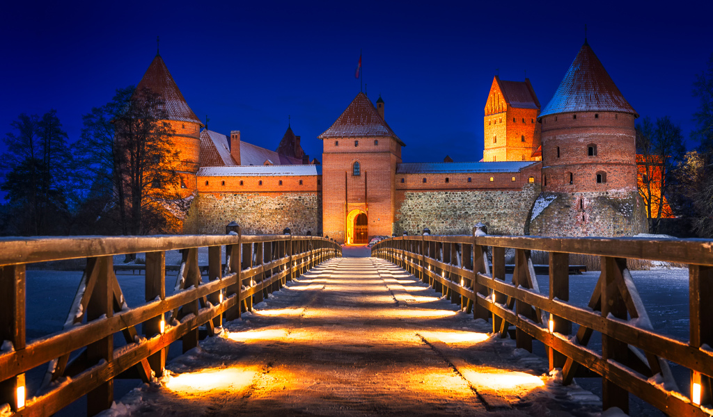 Bridge under the light of night lights to Trakai Castle, Lithuania