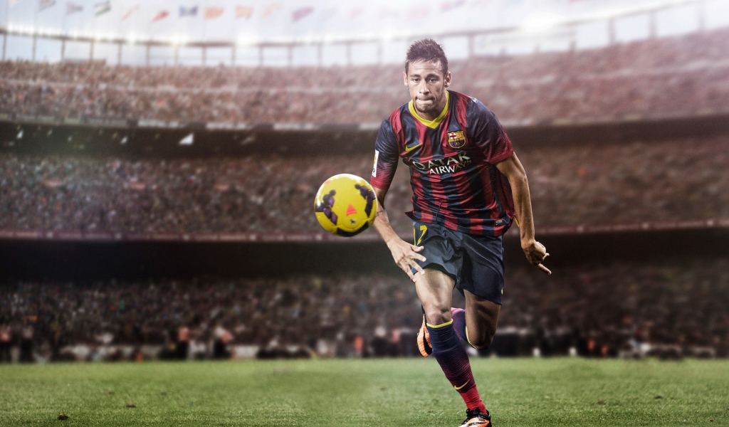 Футболист Неймар на футбольном поле с мячом