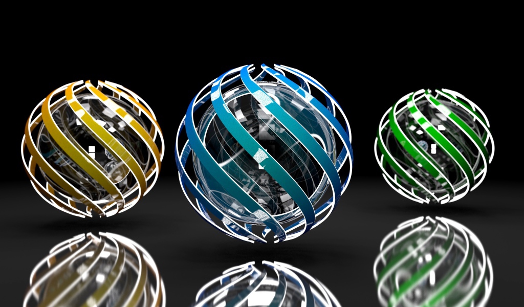 Три разноцветные сферы на сером фоне