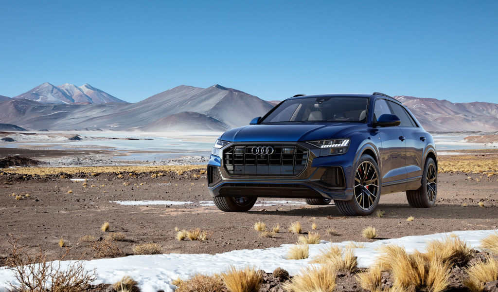 Black car Audi Q8 Quattro, 2018 on the background of the mountains