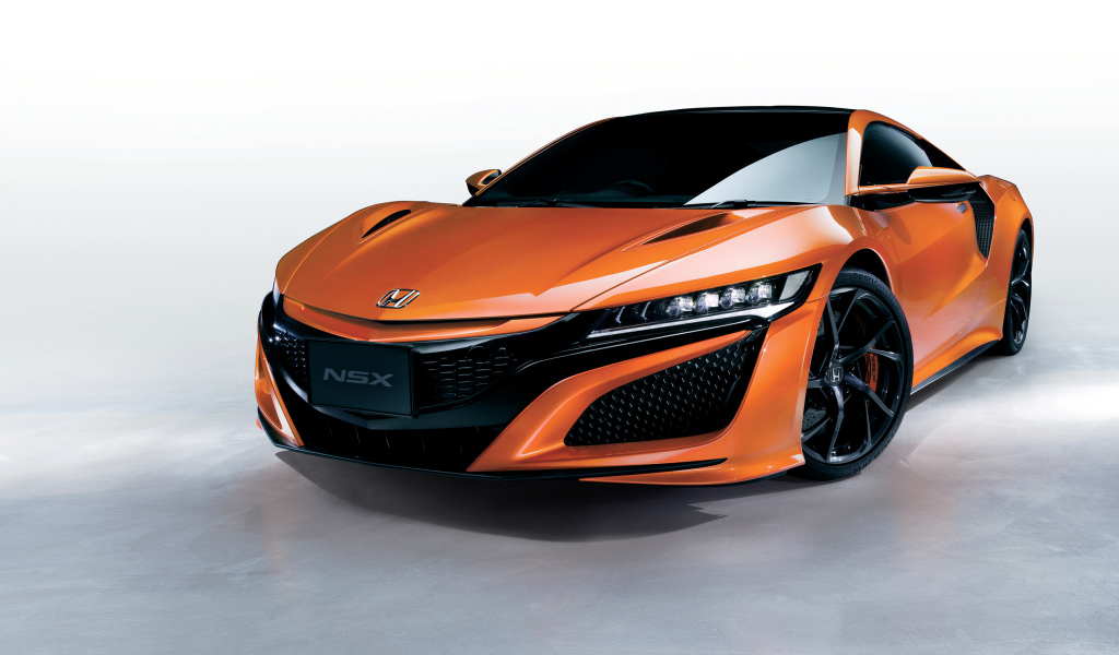 Оранжевый быстрый автомобиль Honda NSX 2018 года