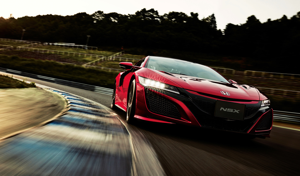 Красный автомобиль Honda NSX на трассе