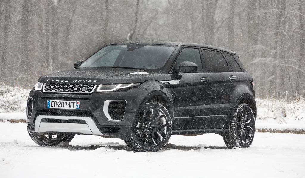 Black SUV Range Rover Evoque Autobiography Si4 on a snowy road