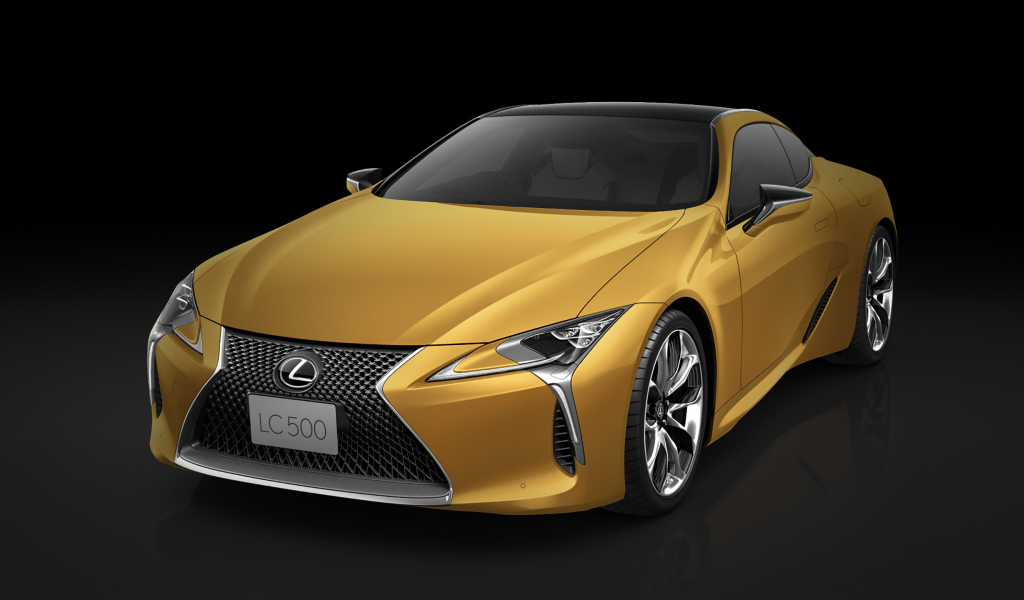 Оранжевый Lexus LC 500 2018 года на черном фоне