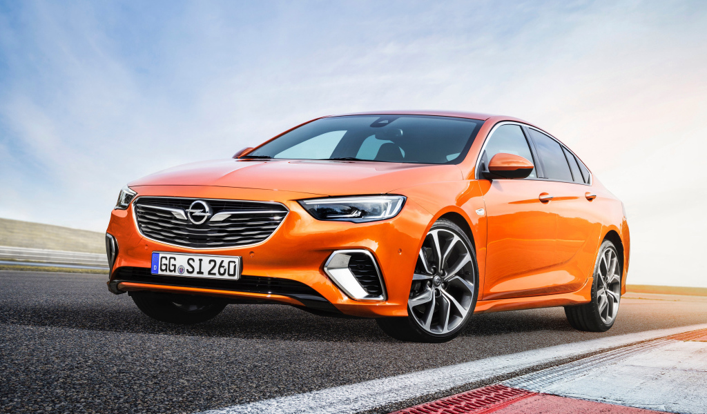 Orange car Opel Insignia GSi, 2018 on the road