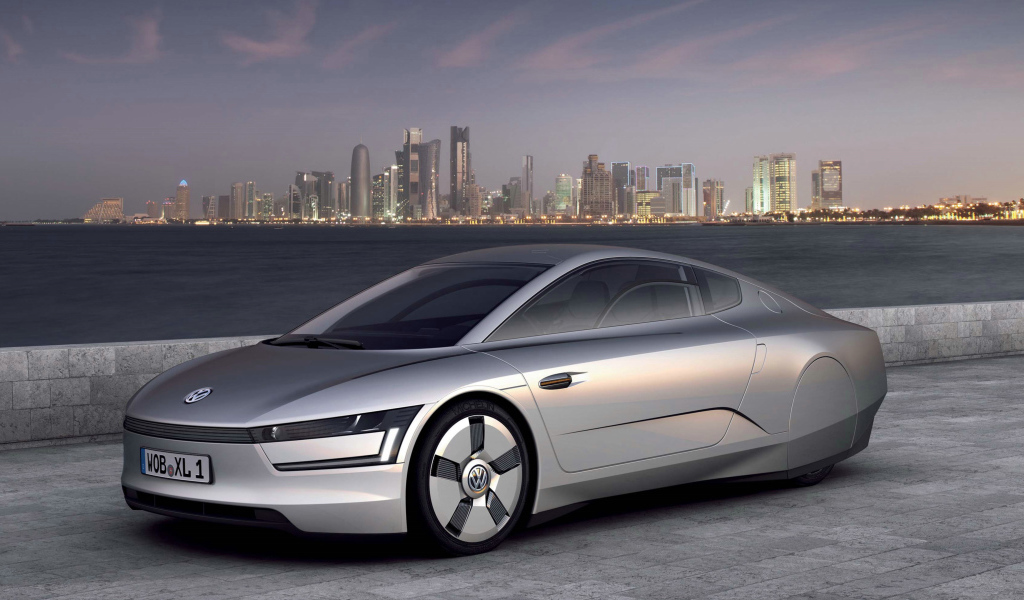 Автомобиль Volkswagen XL1 Concept,  2018 на фоне города