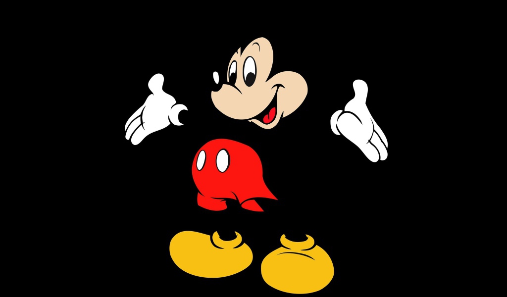 Популярный герой мультфильмов Микки Маус на черном фоне