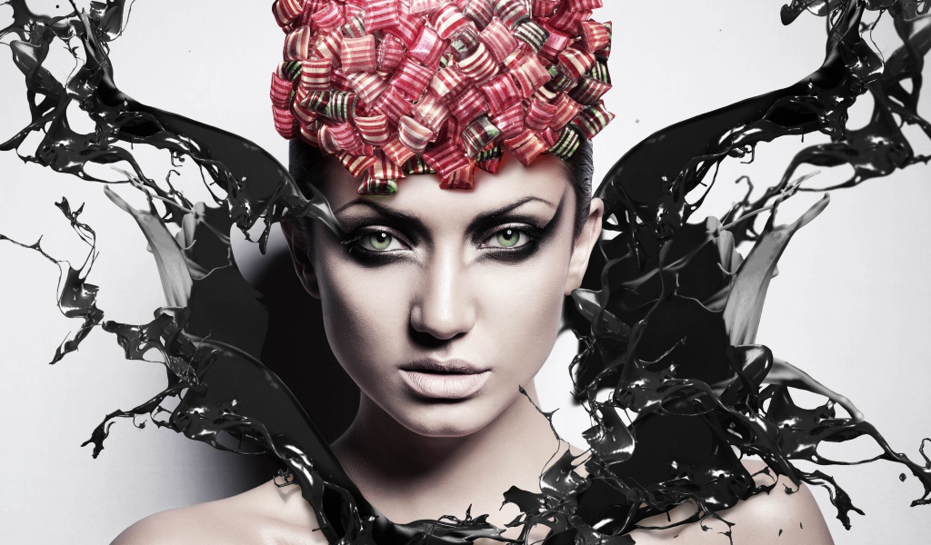 Красивая девушка с макияжем в брызгах черной краски