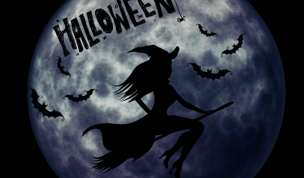 Ведьма на метле на фоне луны на праздник Хэллоуин, 31 октября