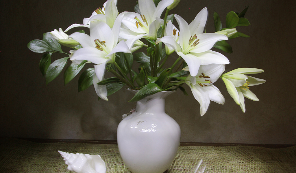 Beautiful bouquet of white lilies in a vase
