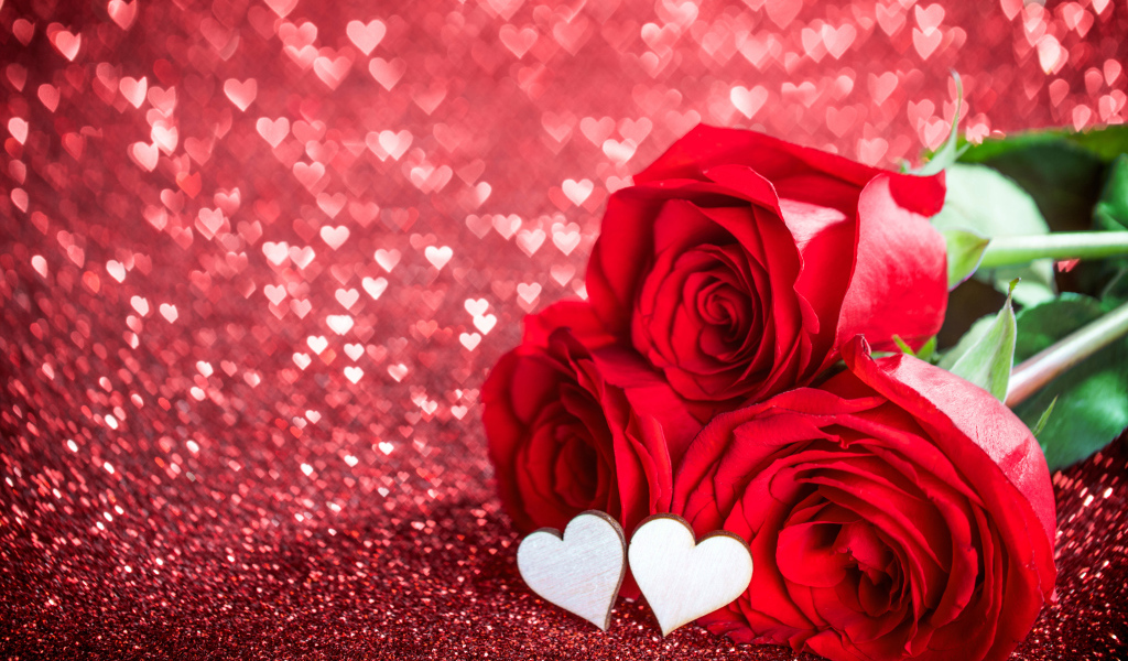 Три красные розы с маленькими белыми сердечками на красном фоне