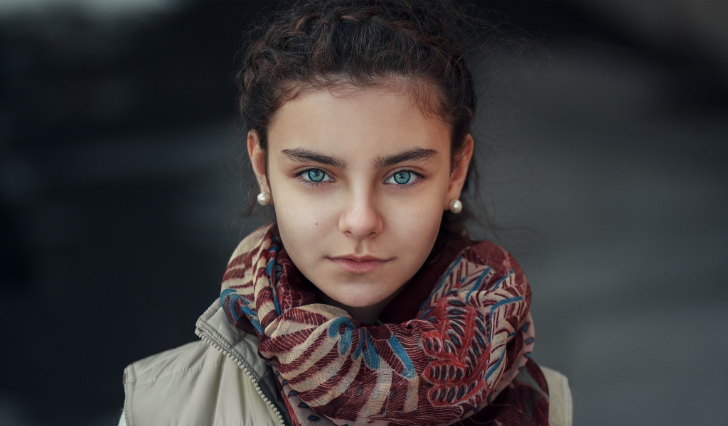 Beautiful girl with a scarf around her neck