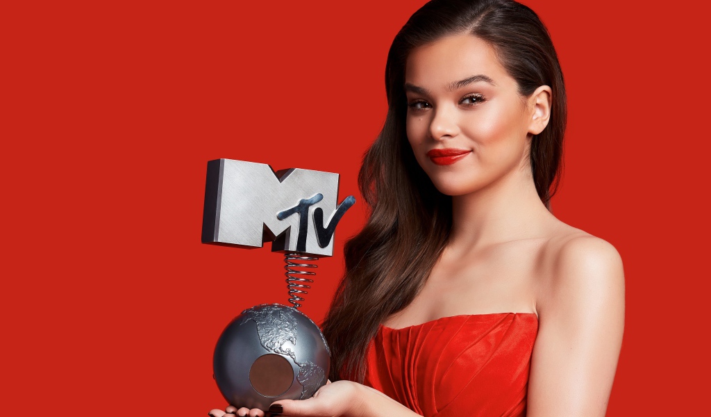 Haley Stainfield with MTV Award on Red Background