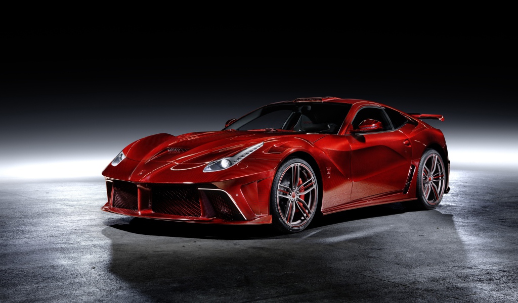 Красный автомобиль Mansory La Revoluzione на сером фоне