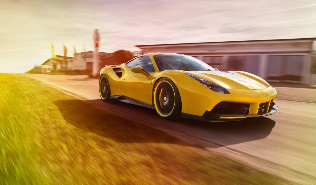 Желтый автомобиль Ferrari 488 GTB на трассе