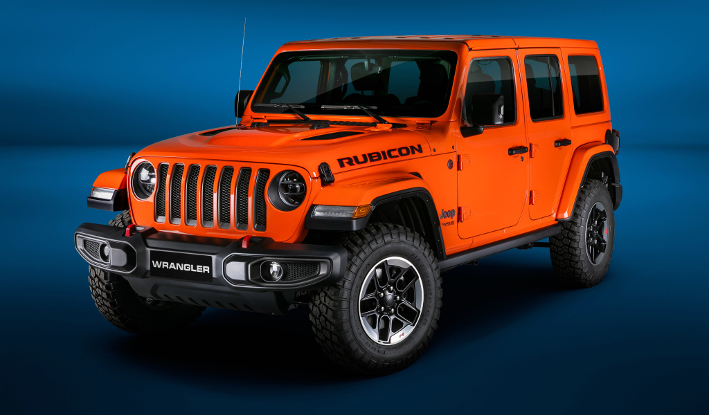 Оранжевый Jeep Wrangler Unlimited Rubicon 2018 года на синем фоне
