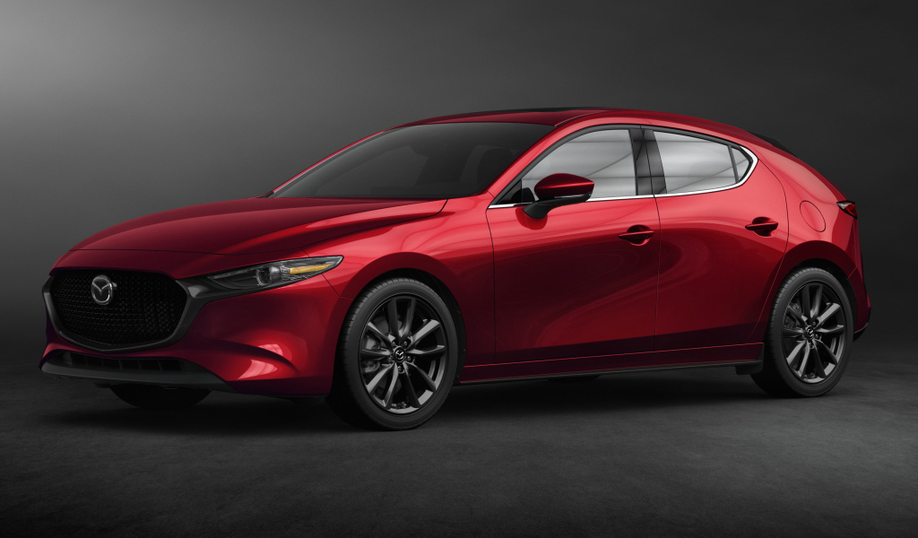 Красный автомобиль Mazda 3, 2020 года на сером фоне