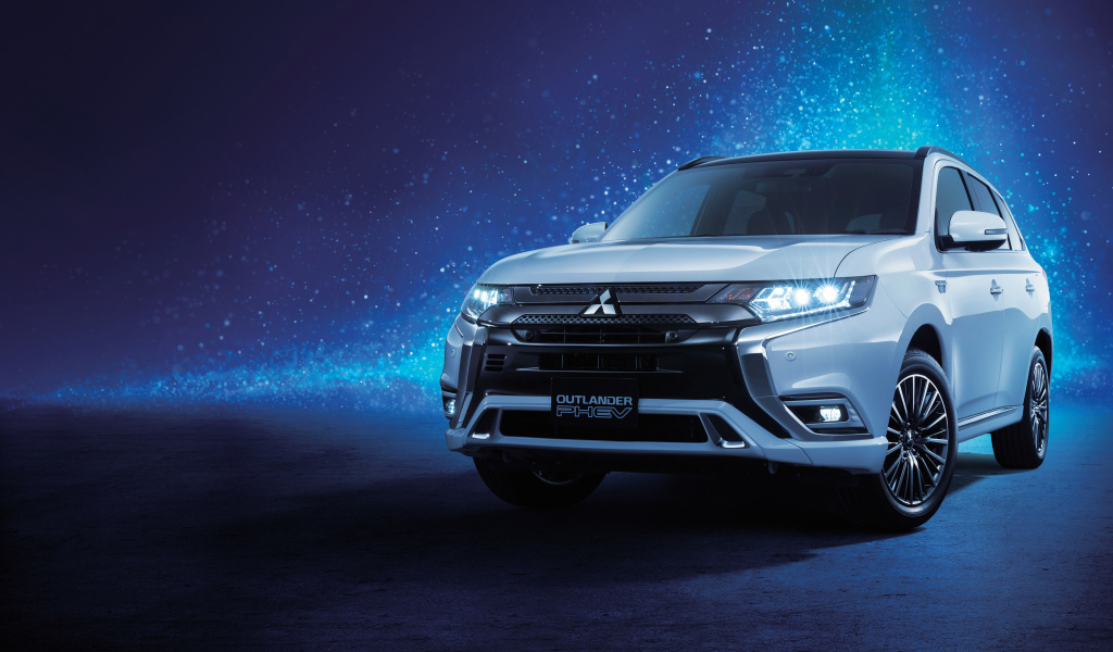 Внедорожник Mitsubishi Outlander  2018 года на неоновом фоне